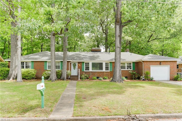 ranch-style house with driveway, a chimney, a front yard, a garage, and brick siding