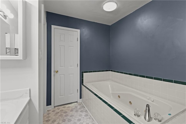 bathroom with a whirlpool tub and baseboards