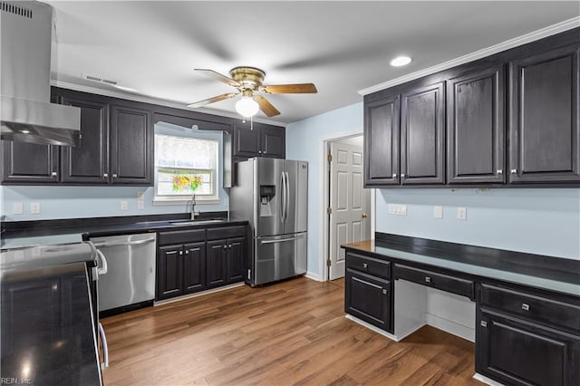 kitchen with visible vents, ceiling fan, extractor fan, a sink, and appliances with stainless steel finishes