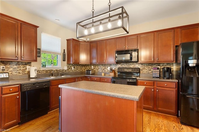 13095 Lighthouse Ln, Carrollton, VA 23314 - kitchen featuring black appliances, a sink, light wood-type flooring, and tasteful backsplash