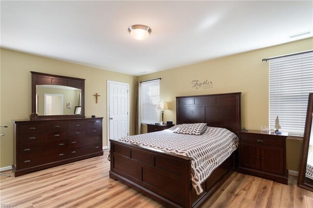 13095 Lighthouse Ln, Carrollton, VA 23314 - bedroom featuring light wood finished floors and baseboards