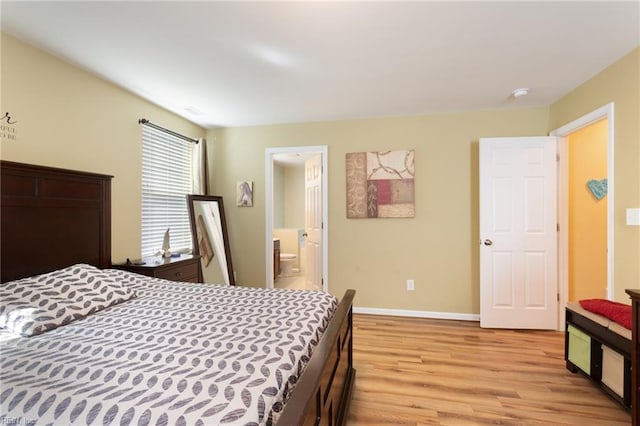 13095 Lighthouse Ln, Carrollton, VA 23314 - bedroom featuring light wood-type flooring, baseboards, and ensuite bath