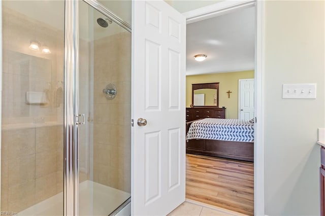 13095 Lighthouse Ln, Carrollton, VA 23314 - ensuite bathroom featuring a stall shower, tile patterned flooring, and vanity