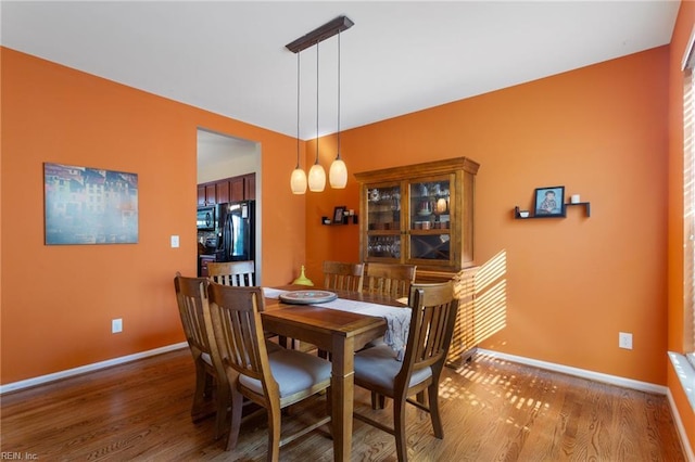 13095 Lighthouse Ln, Carrollton, VA 23314 - dining room featuring wood finished floors and baseboards