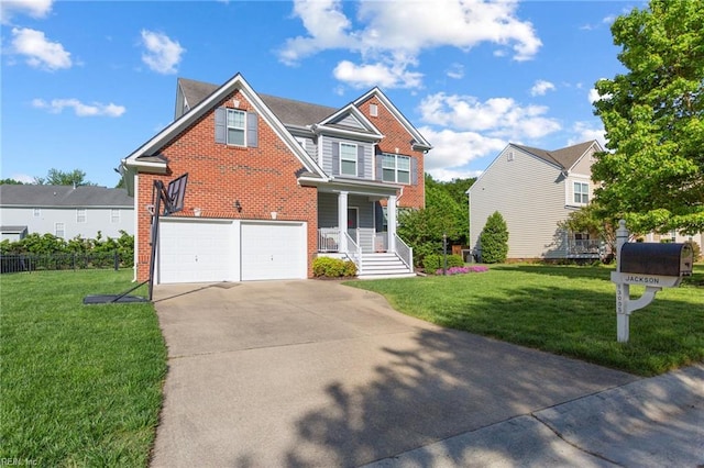 13095 Lighthouse Ln, Carrollton, VA 23314 - traditional-style home featuring an attached garage, concrete driveway, brick siding, and covered porch