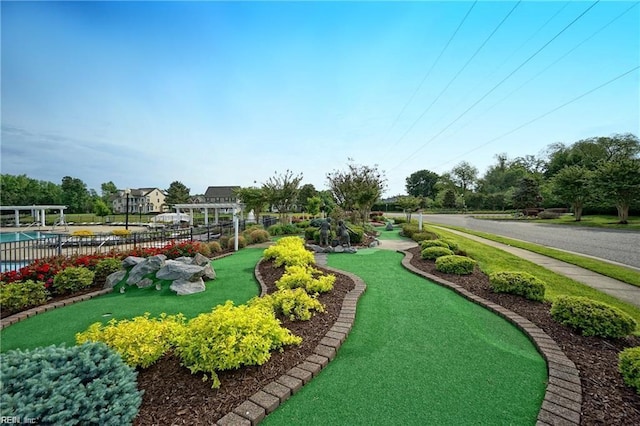 13095 Lighthouse Ln, Carrollton, VA 23314 - surrounding community with a putting green and fence
