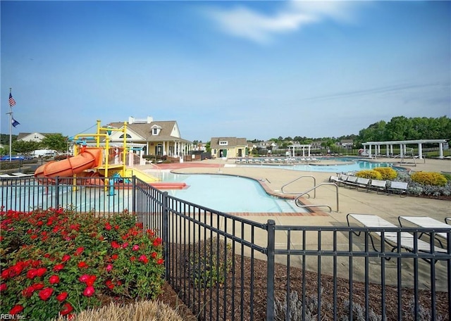 13095 Lighthouse Ln, Carrollton, VA 23314 - community pool featuring a water slide and fence