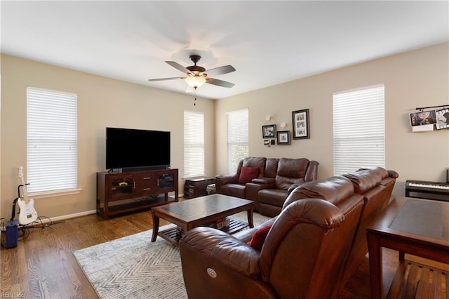 13095 Lighthouse Ln, Carrollton, VA 23314 - living room featuring ceiling fan, wood finished floors, and baseboards