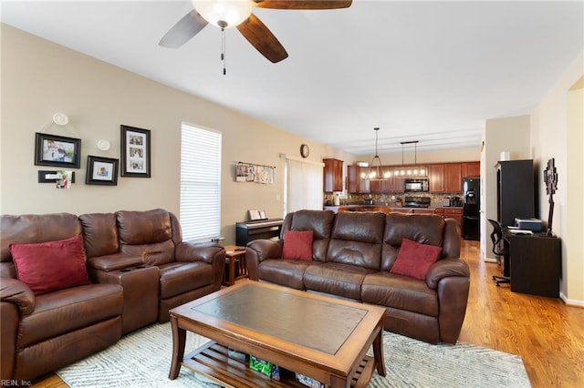 13095 Lighthouse Ln, Carrollton, VA 23314 - living area featuring light wood-style flooring and ceiling fan