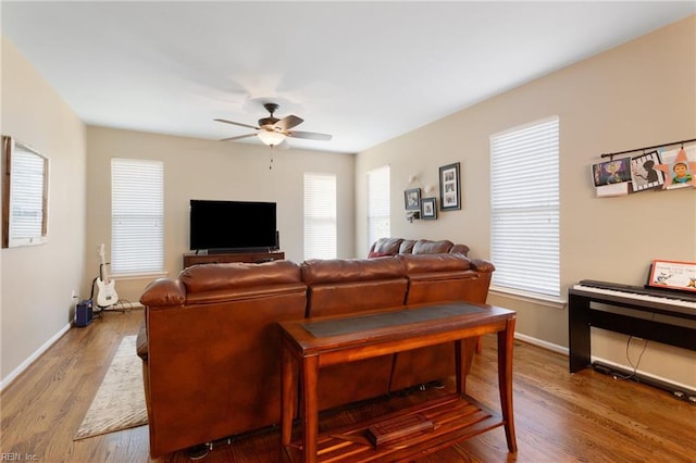 13095 Lighthouse Ln, Carrollton, VA 23314 - living room featuring ceiling fan, healthy amount of natural light, and baseboards