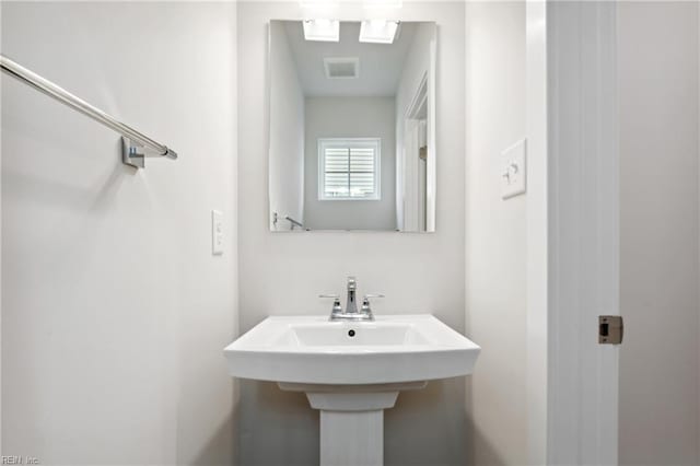 bathroom featuring a sink and visible vents