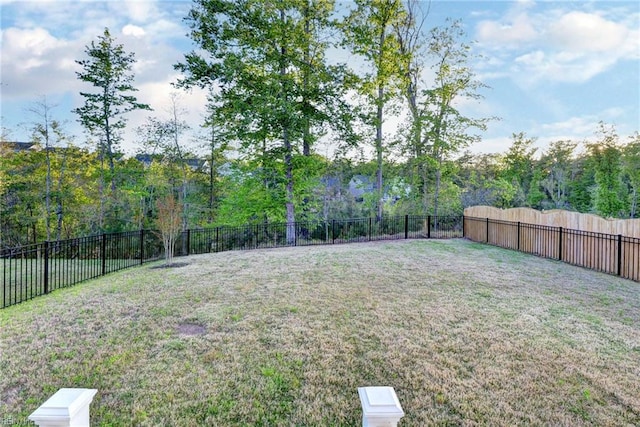view of yard with a fenced backyard
