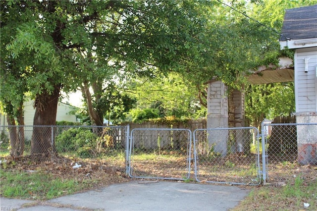 view of gate featuring fence