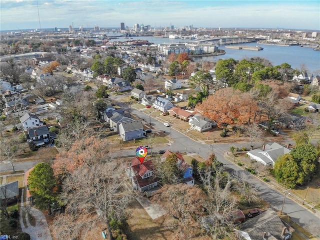 drone / aerial view featuring a water view and a residential view
