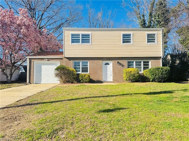 529 Stockton St, Hampton, VA 23669 - colonial home featuring brick siding, driveway, a front lawn, and an attached garage