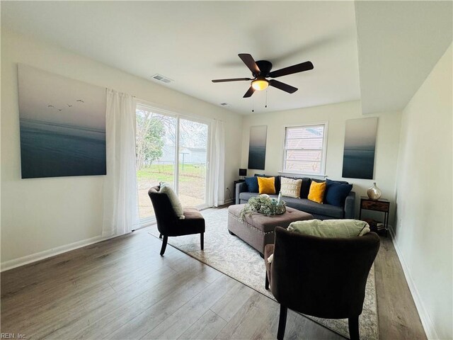 529 Stockton St, Hampton, VA 23669 - living area with wood finished floors, baseboards, and a ceiling fan