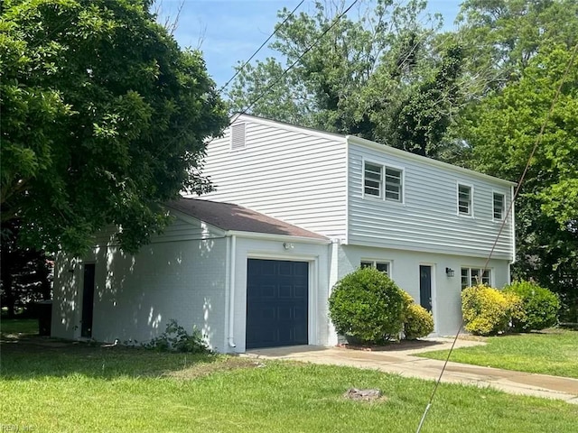 529 Stockton St, Hampton, VA 23669 - view of front of home featuring a front yard, an attached garage, and driveway