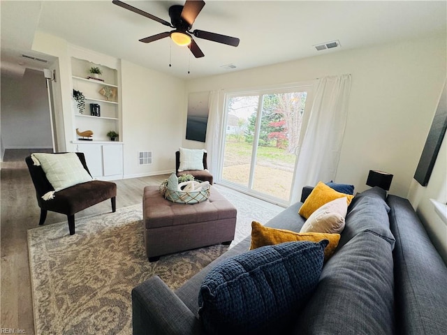 529 Stockton St, Hampton, VA 23669 - living room with wood finished floors, built in features, baseboards, and a ceiling fan