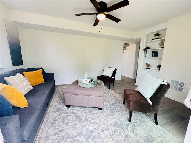 529 Stockton St, Hampton, VA 23669 - living area featuring wood finished floors, baseboards, a ceiling fan, and built in features