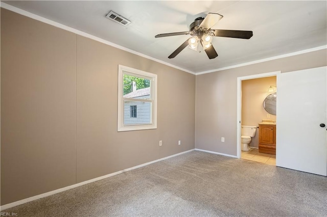 unfurnished bedroom featuring crown molding, light carpet, a ceiling fan, baseboards, and visible vents