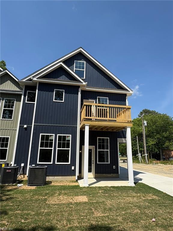 14307 Old Courthouse Way Unit G, Newport News, VA 23602 - view of front of house featuring central AC, a balcony, a front yard, and board and batten siding