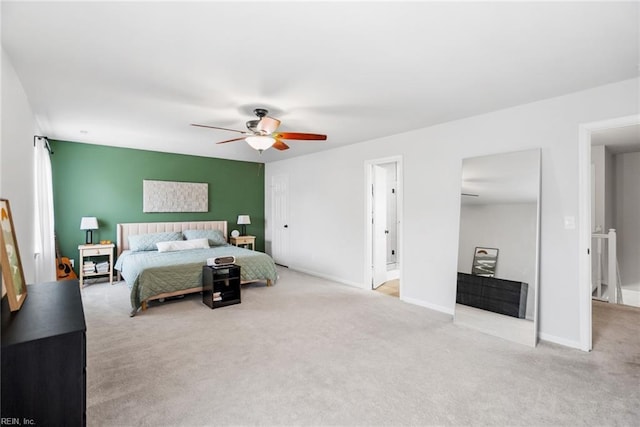 carpeted bedroom with baseboards and ceiling fan