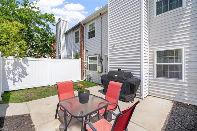 view of patio with fence and grilling area
