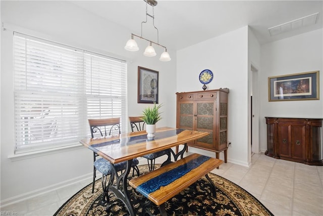 dining area featuring visible vents, baseboards, and light tile patterned floors