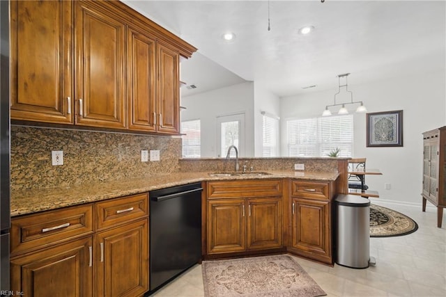 kitchen featuring a sink, a peninsula, dishwasher, and brown cabinets