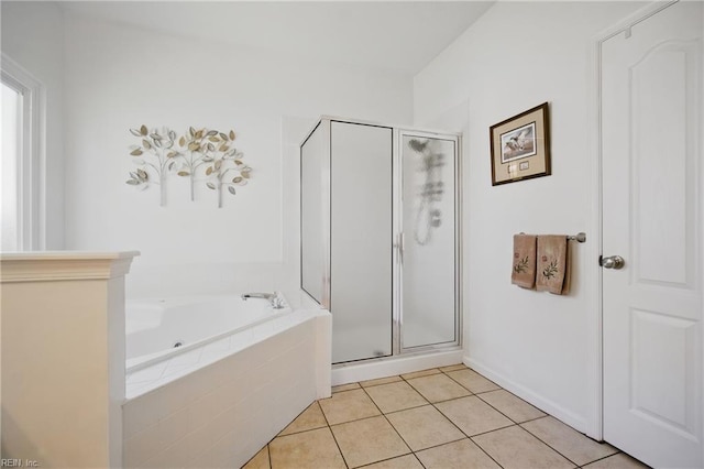 full bathroom with tile patterned flooring, a shower stall, and a bath