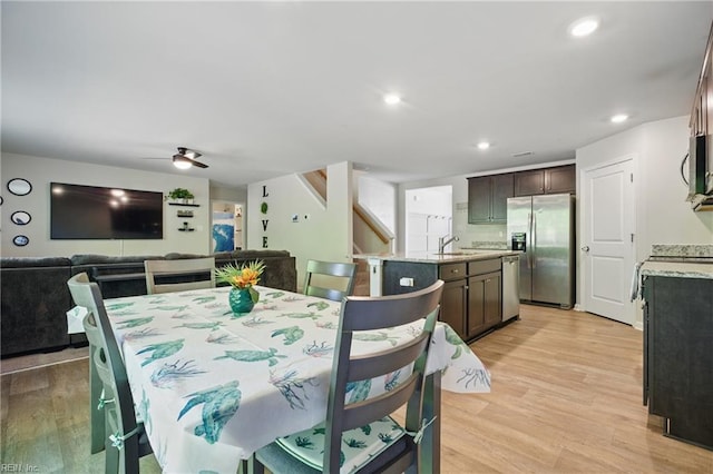 dining area with a ceiling fan, recessed lighting, stairway, and light wood-style floors