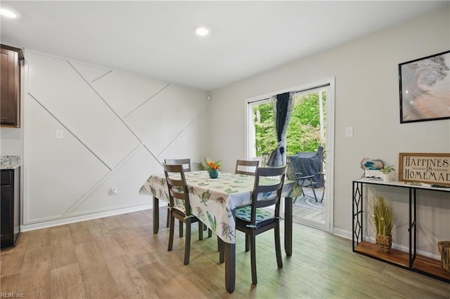 dining room featuring recessed lighting and light wood finished floors