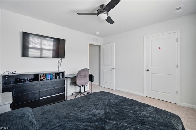 carpeted bedroom with baseboards, ceiling fan, and visible vents