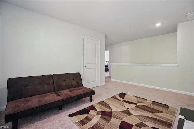 living room featuring carpet floors and baseboards