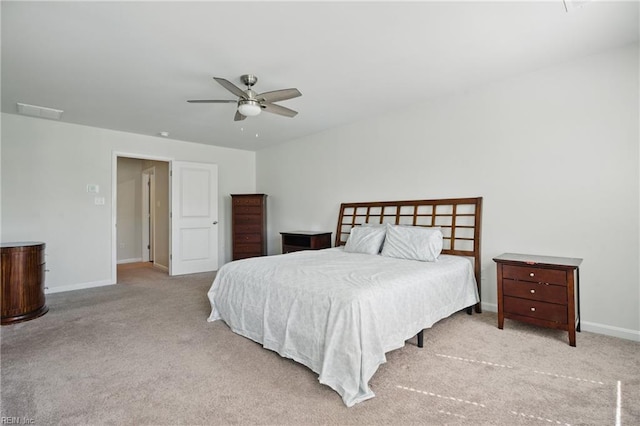 carpeted bedroom featuring baseboards and ceiling fan