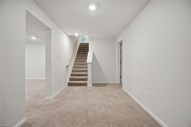 interior space with recessed lighting, carpet, baseboards, and stairway