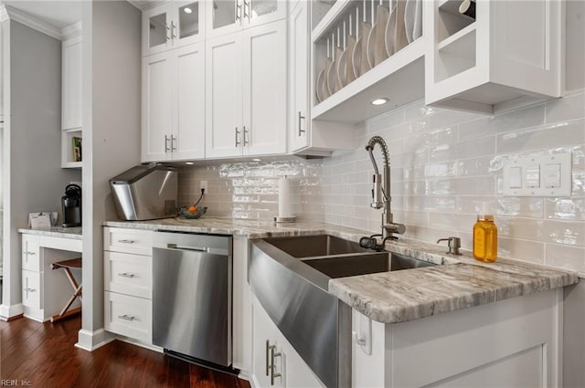 kitchen featuring dark wood-style floors, white cabinets, light stone counters, a sink, and dishwasher