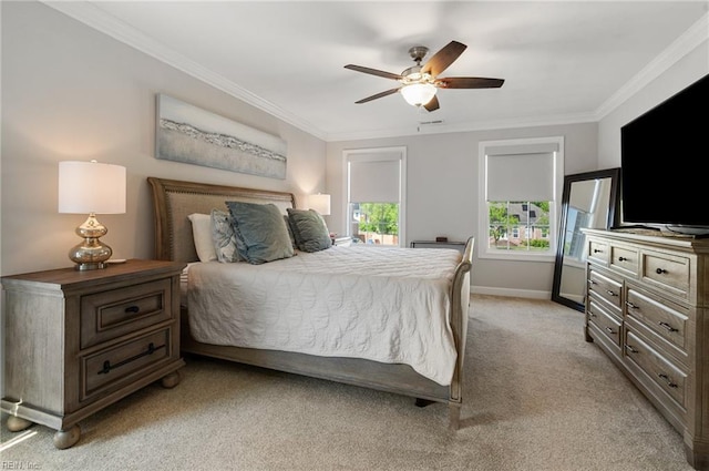 bedroom with crown molding, baseboards, light colored carpet, and ceiling fan