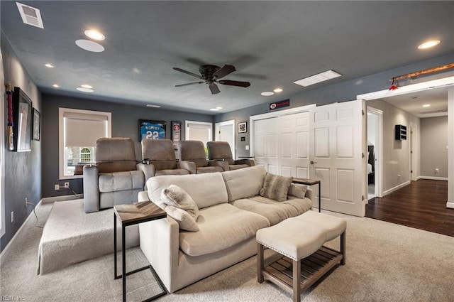 carpeted living area with ceiling fan, visible vents, baseboards, recessed lighting, and a wealth of natural light