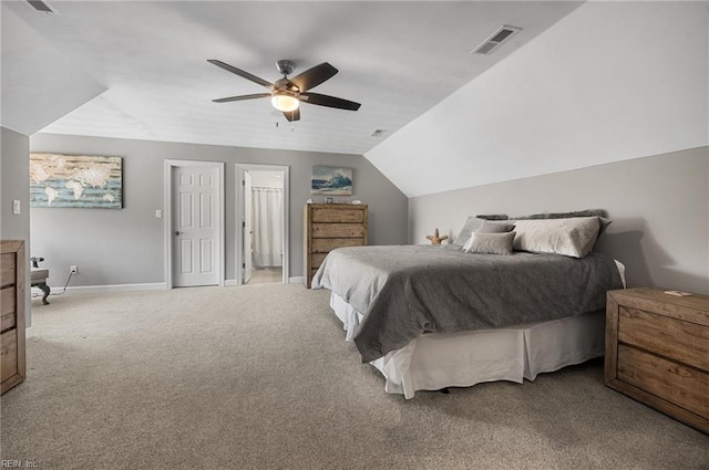 carpeted bedroom with a ceiling fan, baseboards, visible vents, and vaulted ceiling