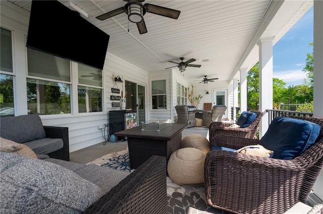 wooden deck featuring a ceiling fan and outdoor dining area