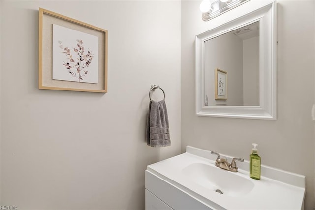 bathroom with vanity and visible vents