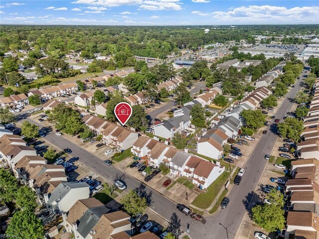 bird's eye view featuring a view of trees and a residential view