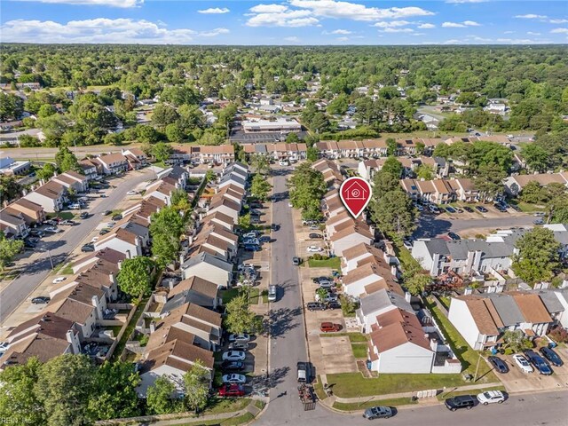 bird's eye view featuring a residential view and a forest view