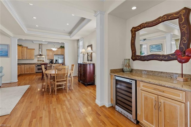 8506 Atlantic Ave Unit B, Virginia Beach, VA 23451 - bar featuring a healthy amount of sunlight, stainless steel fridge with ice dispenser, a raised ceiling, light wood finished floors, and wine cooler