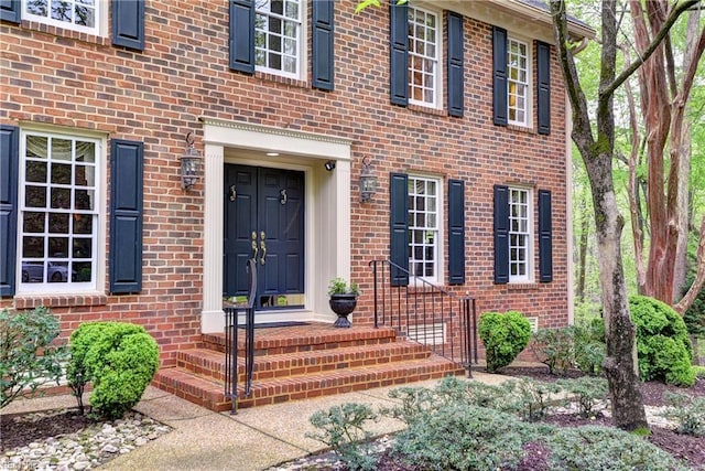 property entrance with brick siding