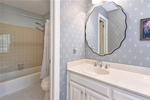 full bathroom with vanity, toilet, tile patterned floors, shower / bath combination with curtain, and wallpapered walls