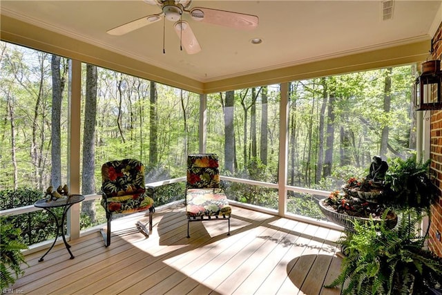 sunroom / solarium featuring visible vents and a ceiling fan