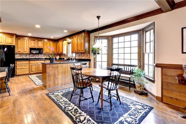 dining room featuring recessed lighting, baseboards, and wood finished floors