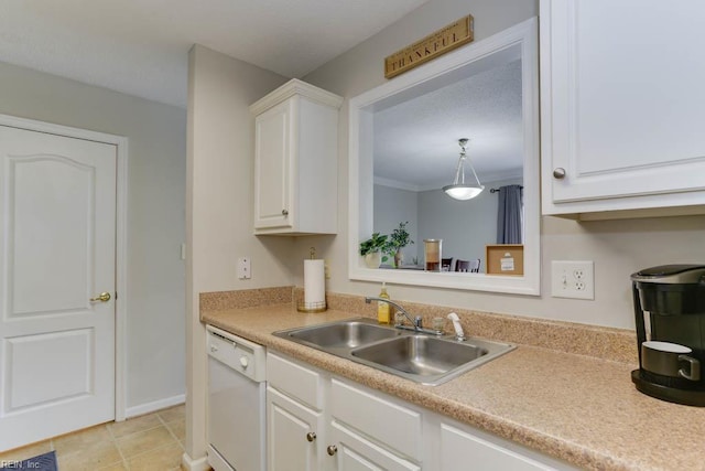 kitchen with a sink, dishwasher, white cabinets, and light countertops